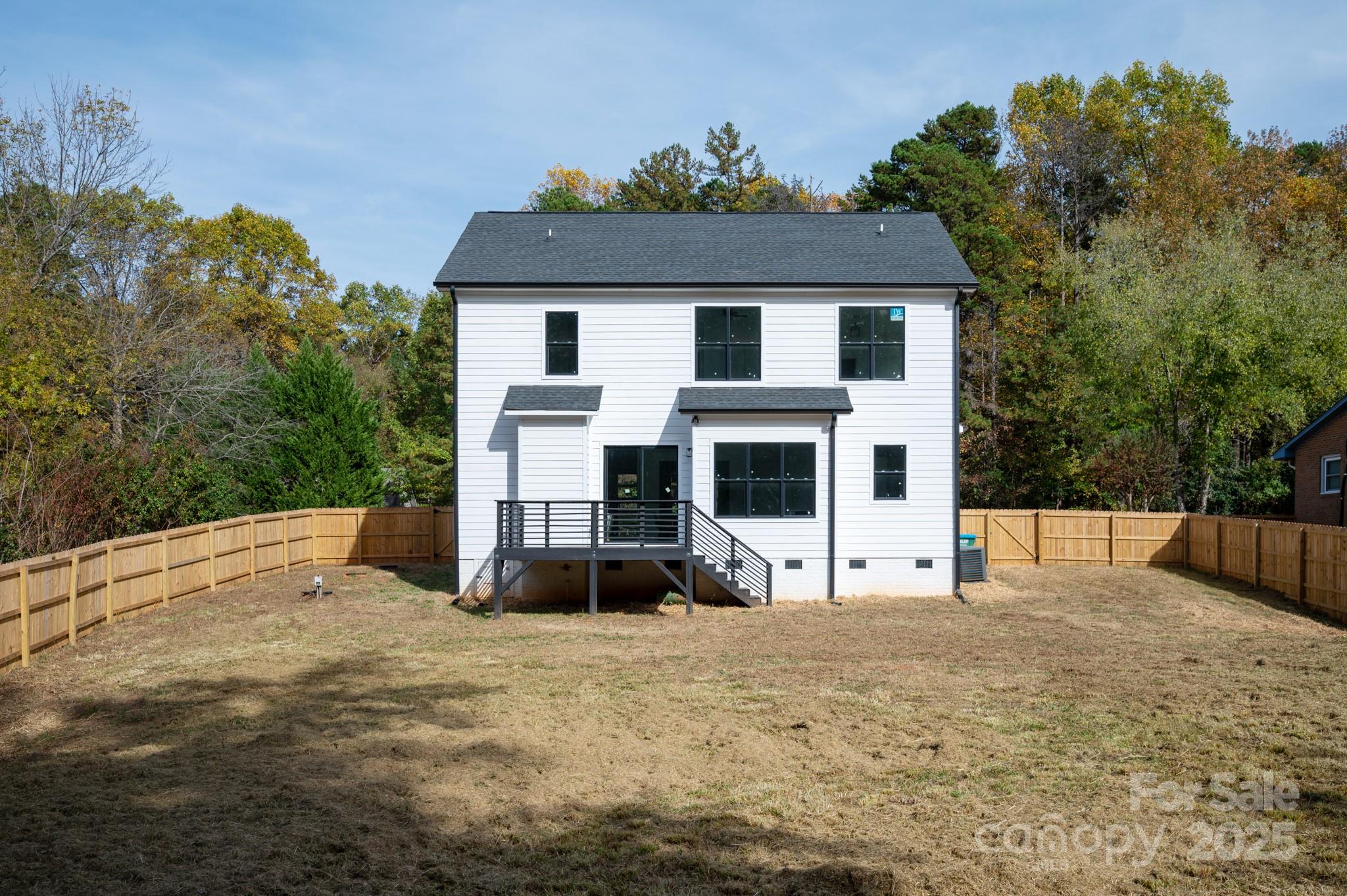 9000 Boyd Drive Matthews, NC 28105 - Photo 26 of 30 a view of a white house with a yard and sitting area
