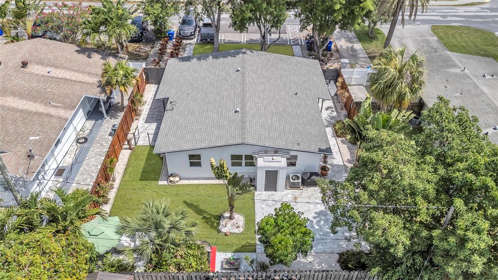 2412 Northeast 4th Street, Unit W Pompano Beach, FL 33062 - Photo 5 of 25 an aerial view of a house with a garden and plants