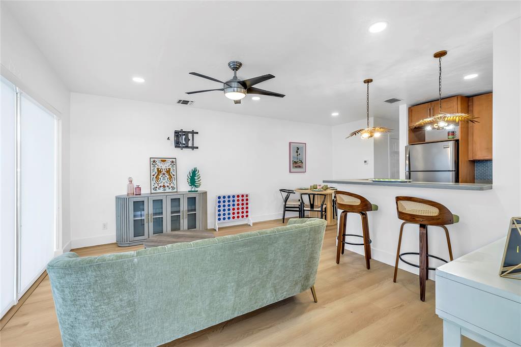 2412 Northeast 4th Street, Unit W Pompano Beach, FL 33062 - Photo 10 of 25 a living room with furniture and a large window