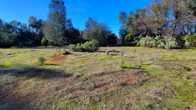 a view of a swimming pool with an outdoor space and seating area