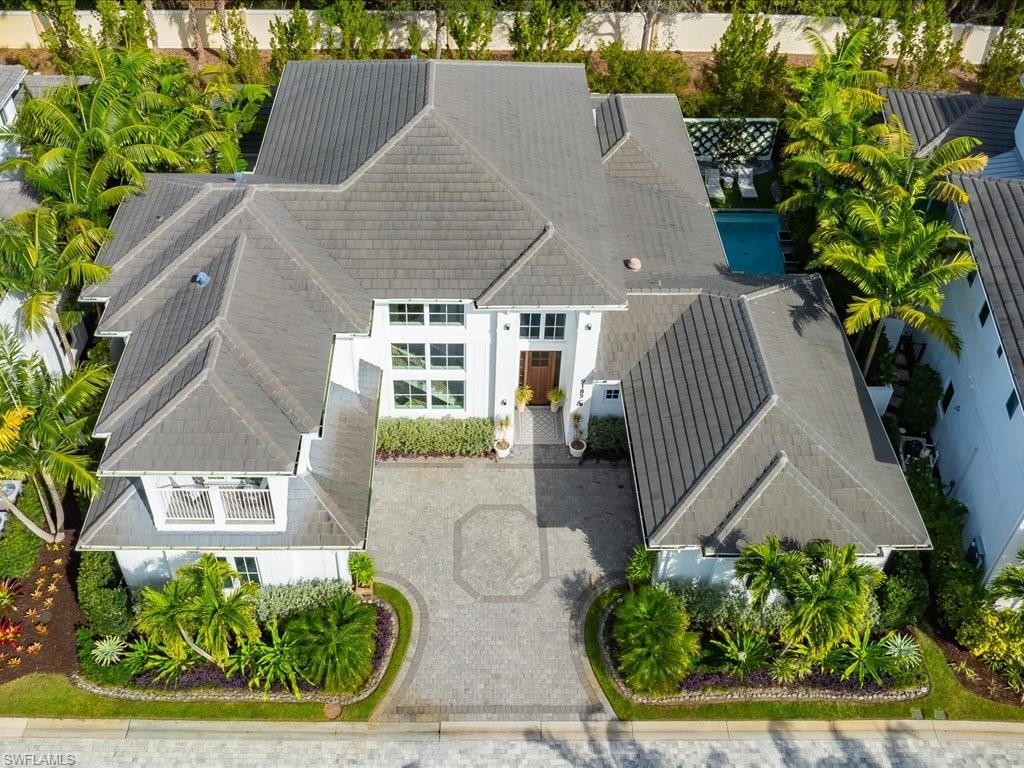 9185 Mercato Way Naples, FL 34108 - Photo 12 of 50 an aerial view of a house with a yard and potted plants