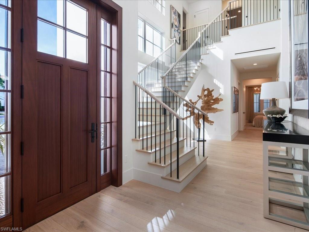 9185 Mercato Way Naples, FL 34108 - Photo 14 of 50 a view of entryway and hall with wooden floor