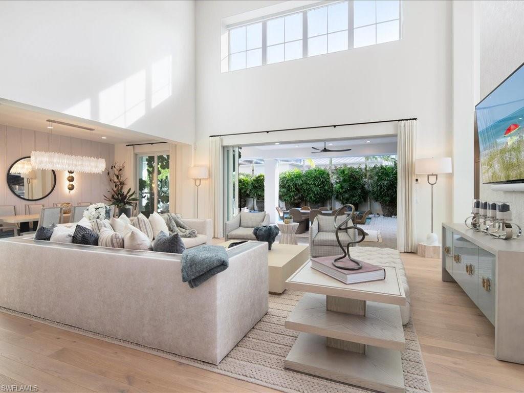 9185 Mercato Way Naples, FL 34108 - Photo 19 of 50 a living room with furniture and a large window