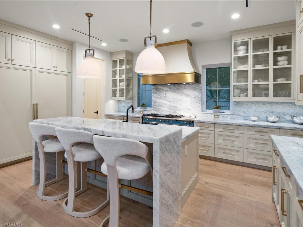 9185 Mercato Way Naples, FL 34108 - Photo 21 of 50 a kitchen with granite countertop counter space a sink appliances and cabinets