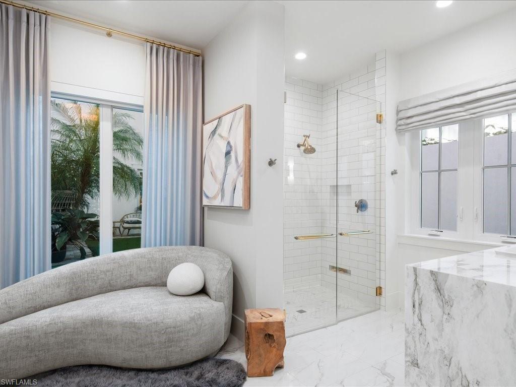 9185 Mercato Way Naples, FL 34108 - Photo 29 of 50 a living room with furniture and a large window