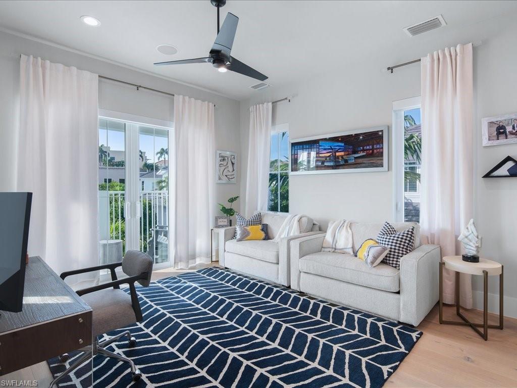 9185 Mercato Way Naples, FL 34108 - Photo 39 of 50 a living room with furniture and a window