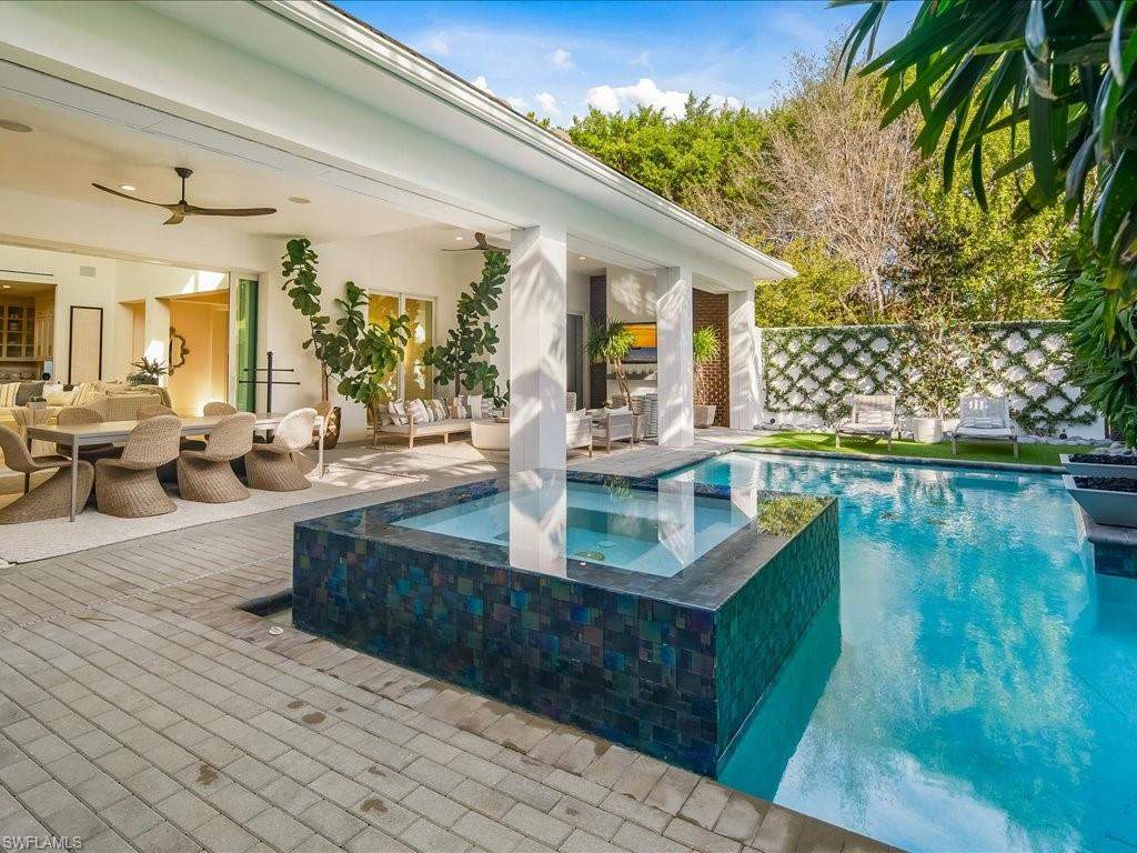 9185 Mercato Way Naples, FL 34108 - Photo 45 of 50 a view of a living room and kitchen