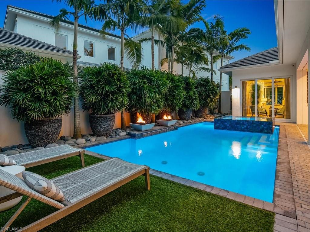 9185 Mercato Way Naples, FL 34108 - Photo 6 of 50 a view of a house with backyard and a patio