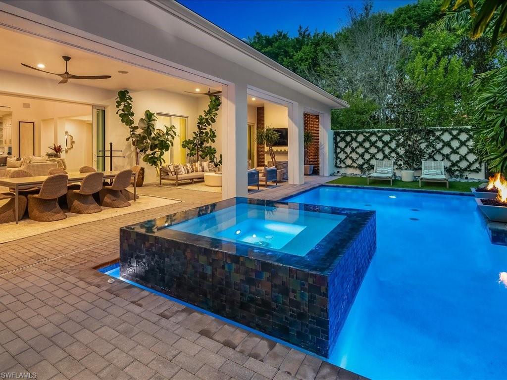 9185 Mercato Way Naples, FL 34108 - Photo 8 of 50 a living room with furniture and a large window