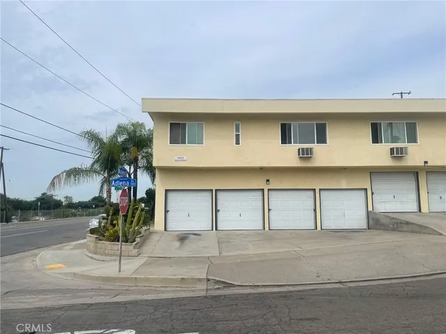 a front view of a house with a garage