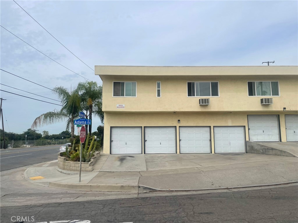701 Adlena Drive, Unit 4 Fullerton, CA 92833 - Photo 14 of 14 a front view of a house with a garage