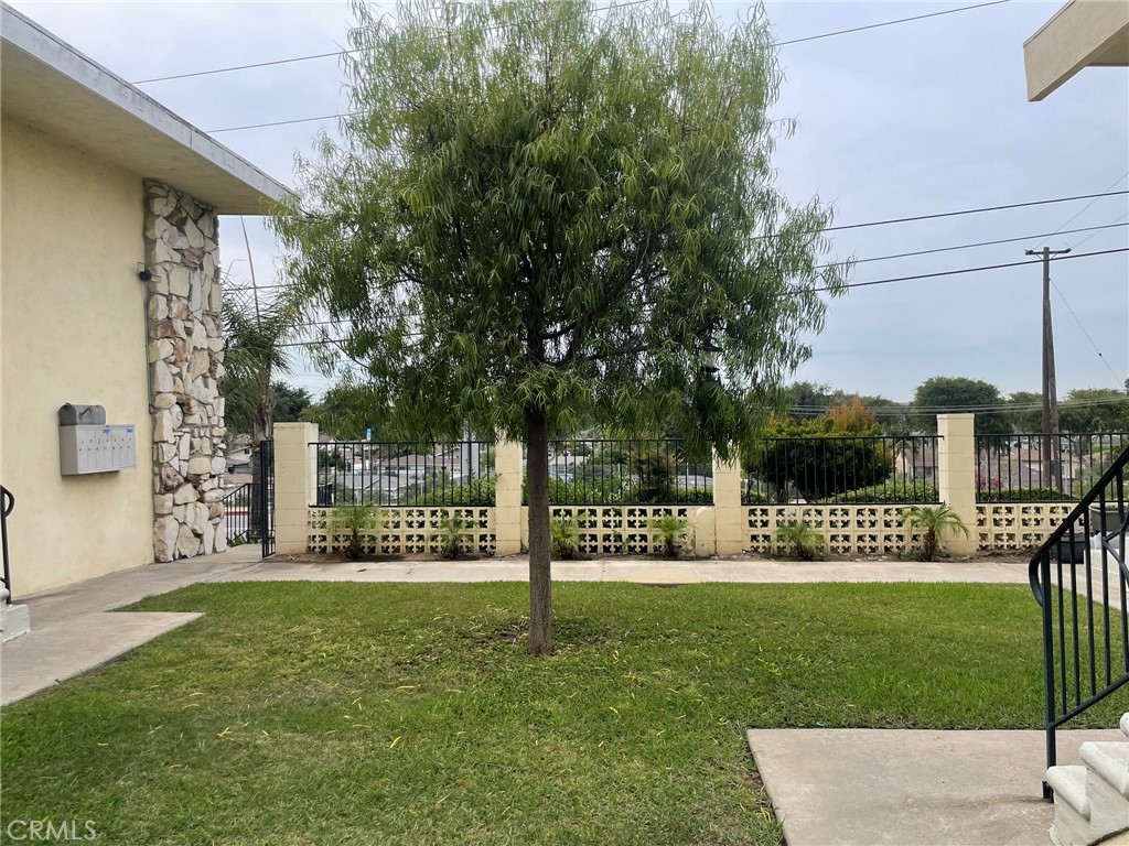 701 Adlena Drive, Unit 4 Fullerton, CA 92833 - Photo 3 of 14 a view of a park that has a sign on a brick wall