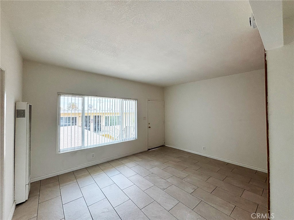 701 Adlena Drive, Unit 4 Fullerton, CA 92833 - Photo 5 of 14 a view of an empty room with a window