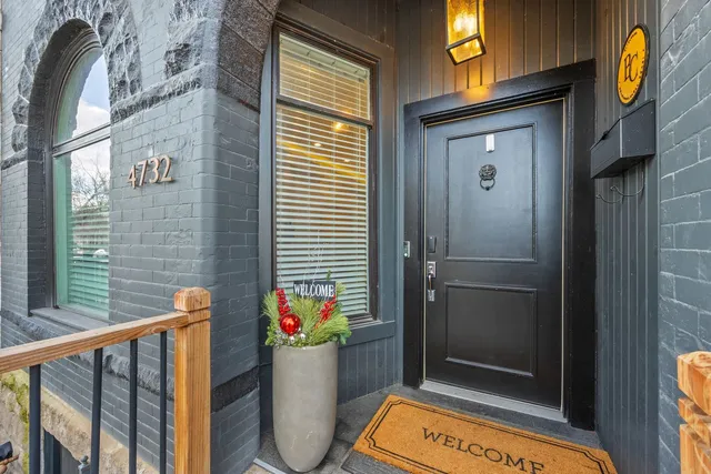 a living room with fireplace furniture and a wooden floor