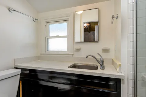 a sink with a mirror