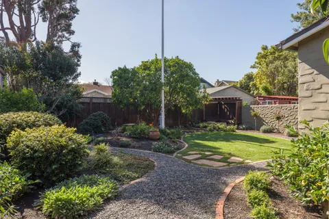 a front view of a house with garden