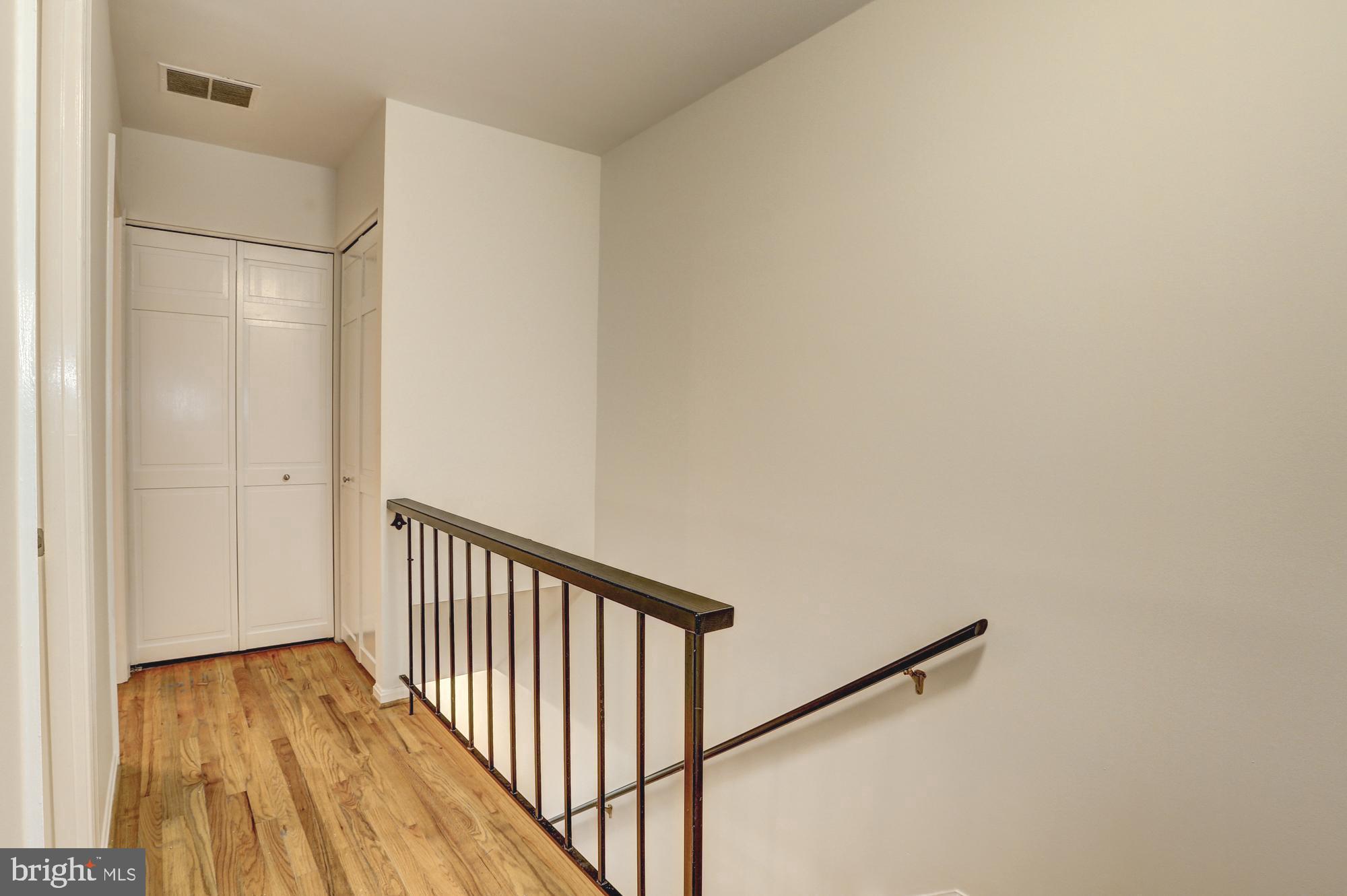 1325 13th Street Northwest, Unit 29 Washington, DC 20005 - Photo 22 of 48 Upstairs hallway with linen closet & washer/dryer