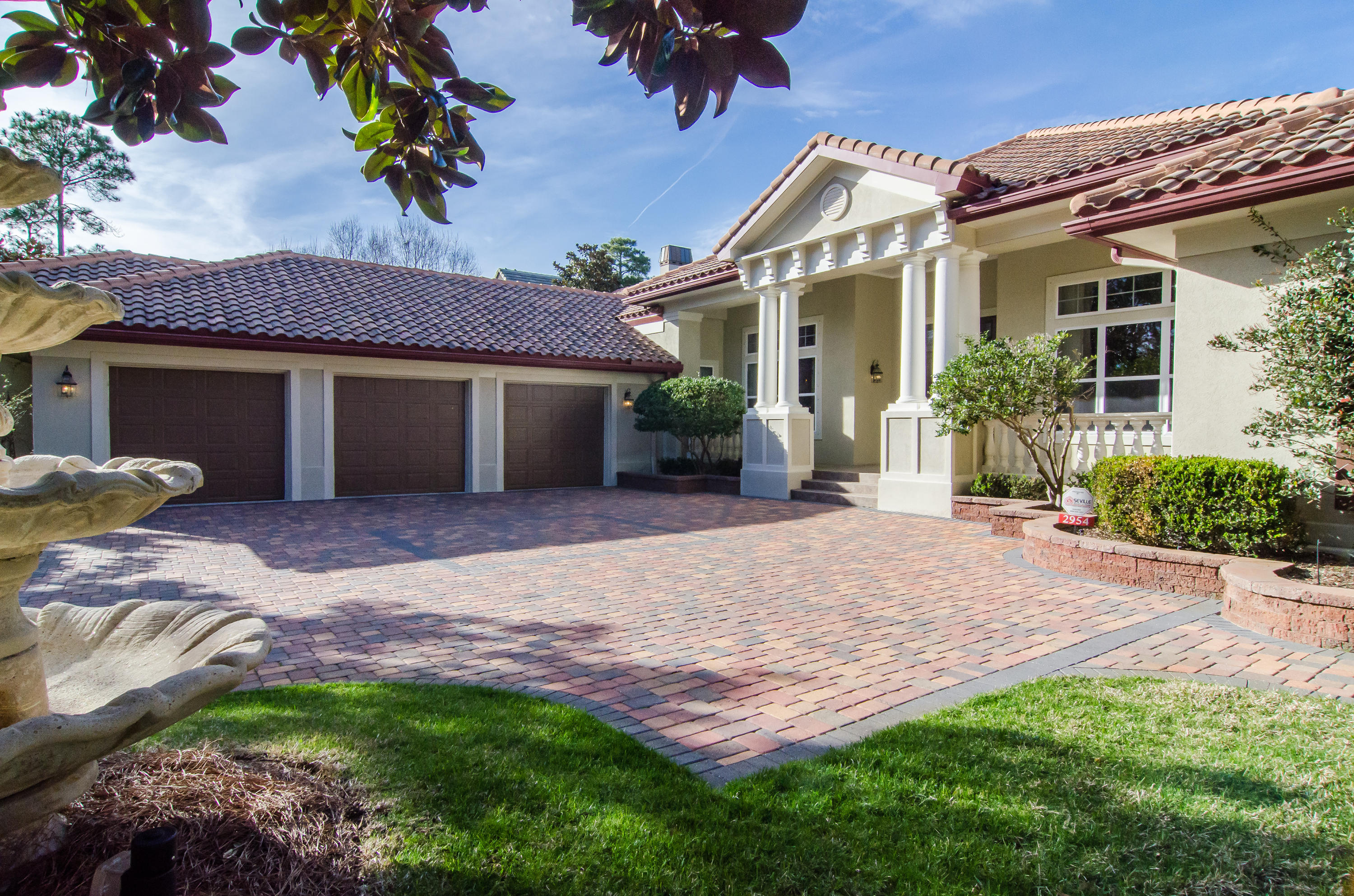 2954 Pine Valley Road Miramar Beach, FL 32550 - Photo 3 of 54 a front view of a house with a yard and potted plants