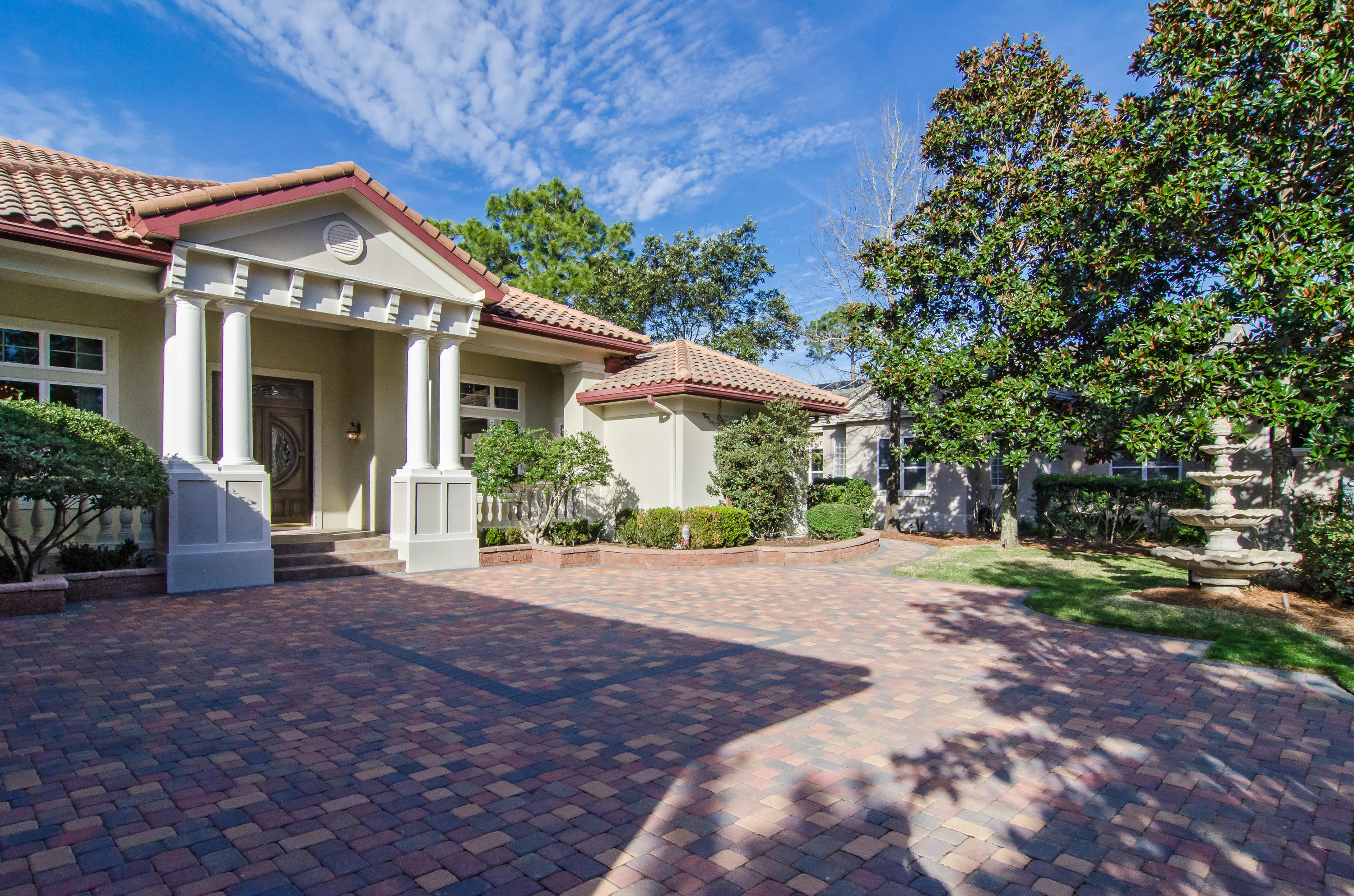 2954 Pine Valley Road Miramar Beach, FL 32550 - Photo 5 of 54 a front view of a house with a yard and garage