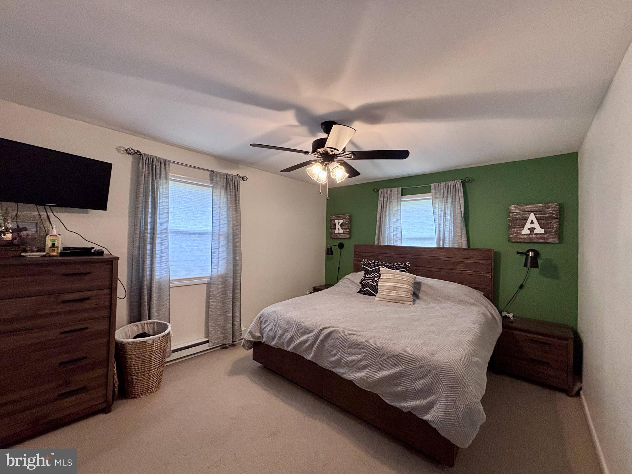 1119 East Meadow Road Manheim, PA 17545 - Photo 12 of 29 a bedroom with a bed and a chandelier
