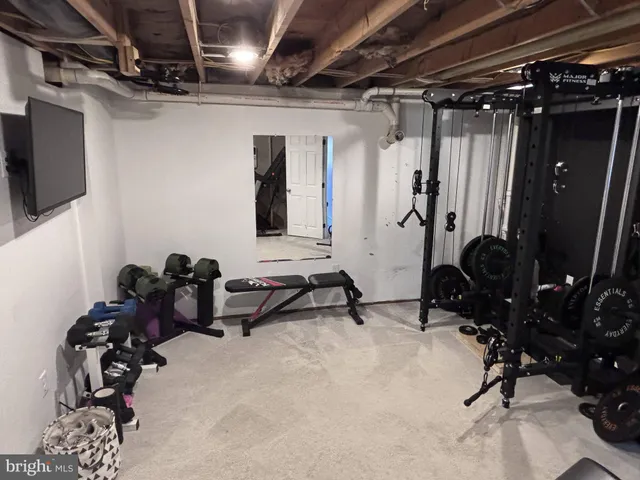 a room with gym equipment and a window