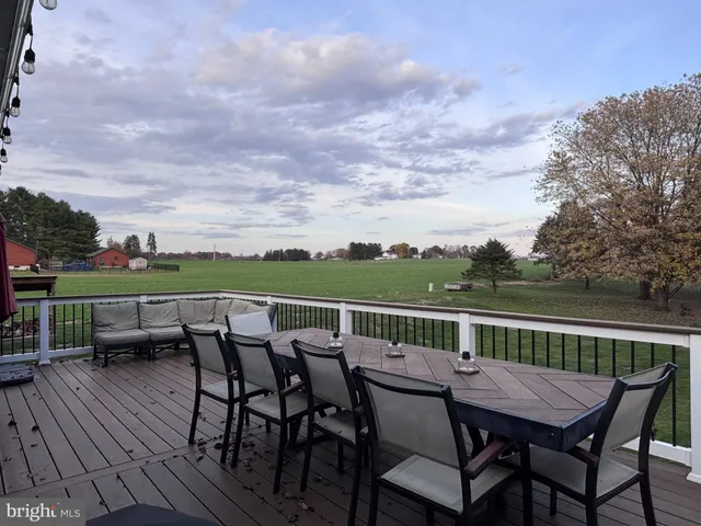 a view of a patio with iron fence