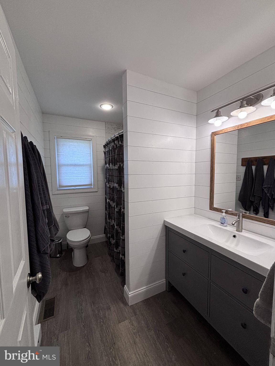 1119 East Meadow Road Manheim, PA 17545 - Photo 10 of 29 a bathroom with a double vanity sink toilet and mirror