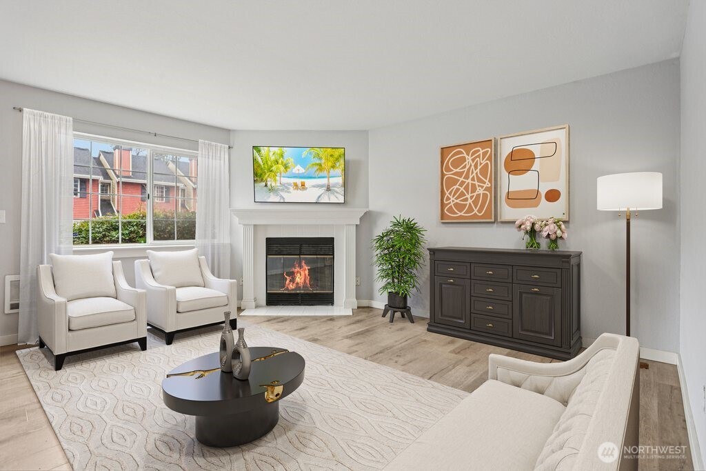 412 Center Road, Unit A1 Everett, WA 98204 - Photo 1 of 23 a living room with furniture and a fireplace