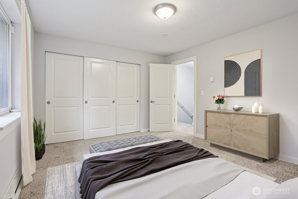 412 Center Road, Unit A1 Everett, WA 98204 - Photo 14 of 23 a bedroom with bed and cabinets