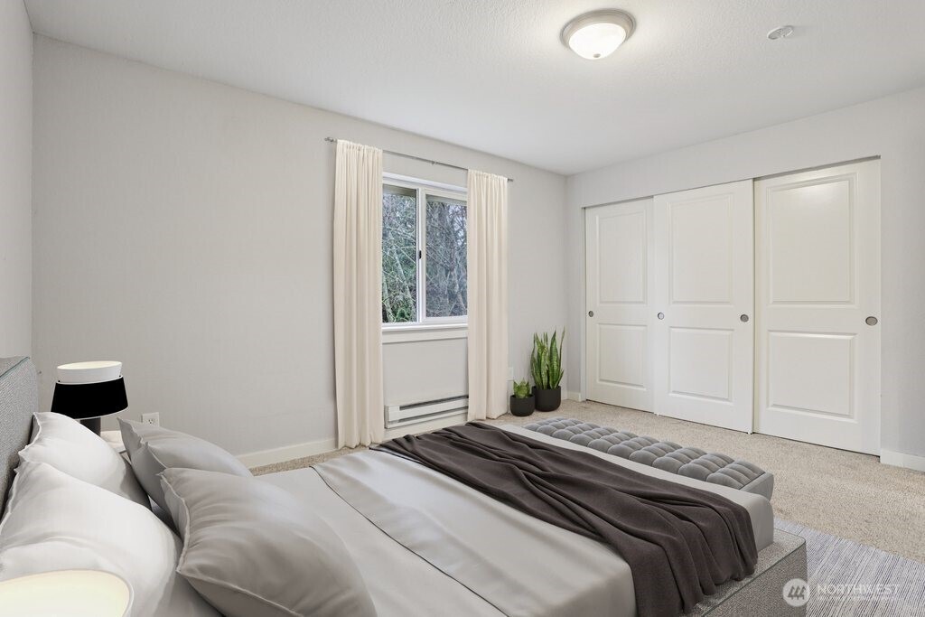 412 Center Road, Unit A1 Everett, WA 98204 - Photo 15 of 23 a bedroom with a bed and a window