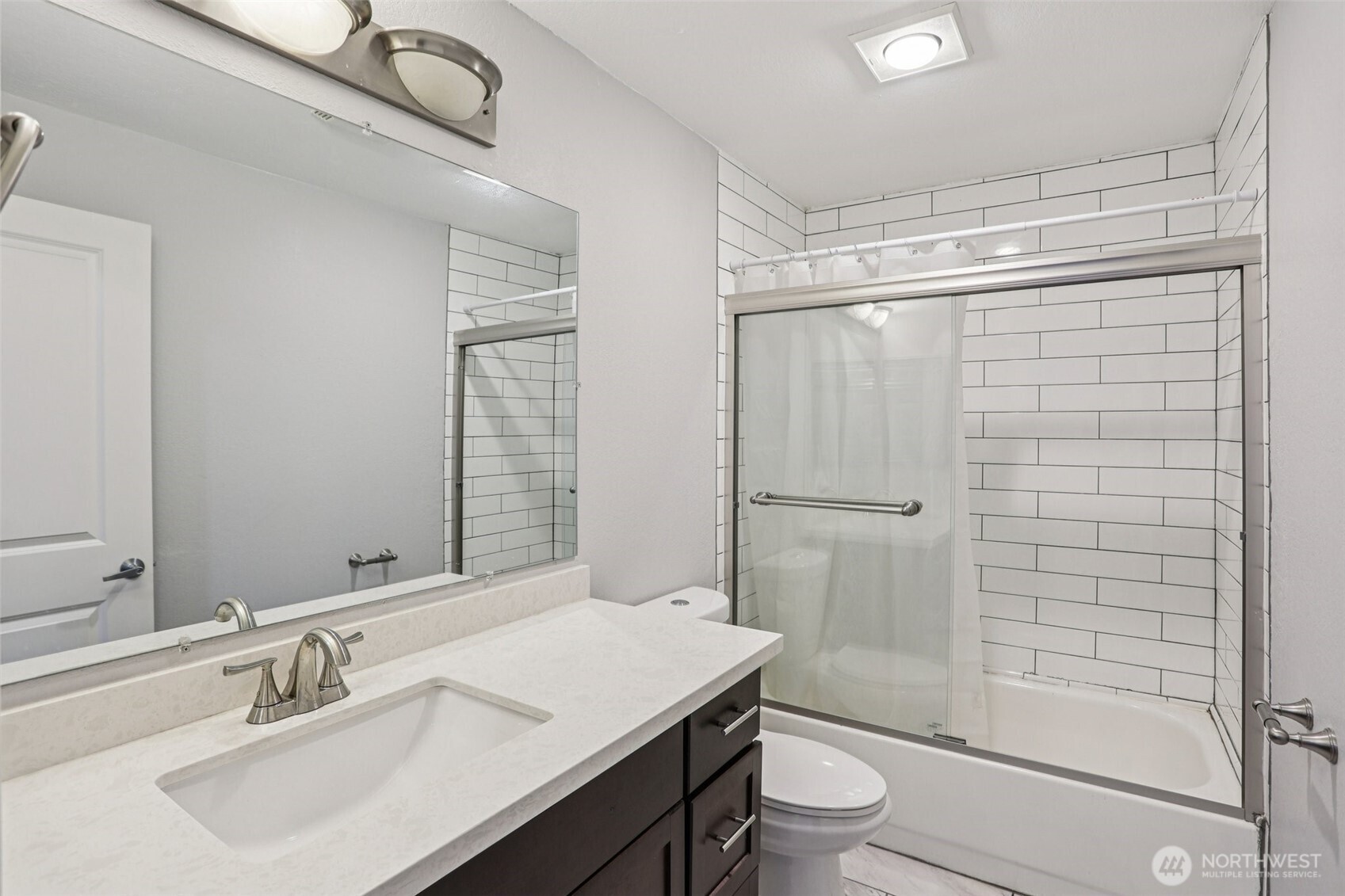 412 Center Road, Unit A1 Everett, WA 98204 - Photo 16 of 23 a bathroom with a sink a toilet and shower