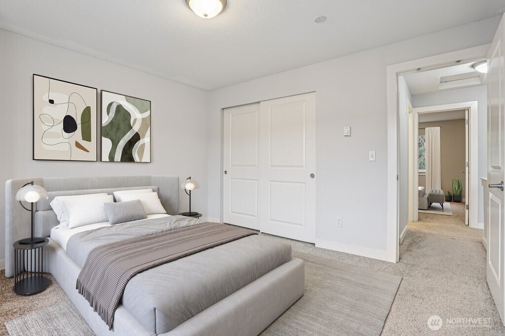 412 Center Road, Unit A1 Everett, WA 98204 - Photo 18 of 23 a bedroom with a bed and a painting on the wall