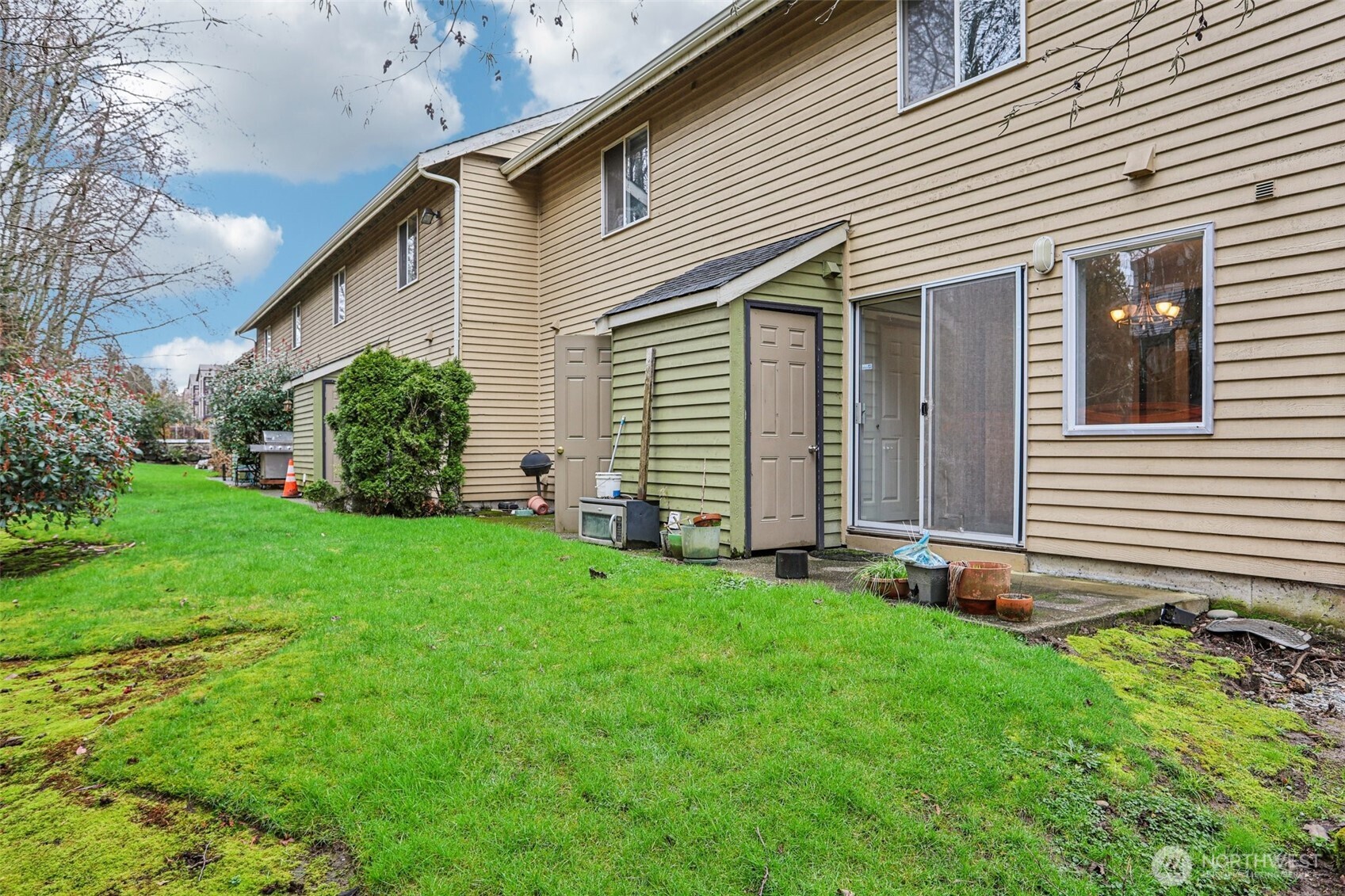 412 Center Road, Unit A1 Everett, WA 98204 - Photo 21 of 23 a front view of a house with a garden