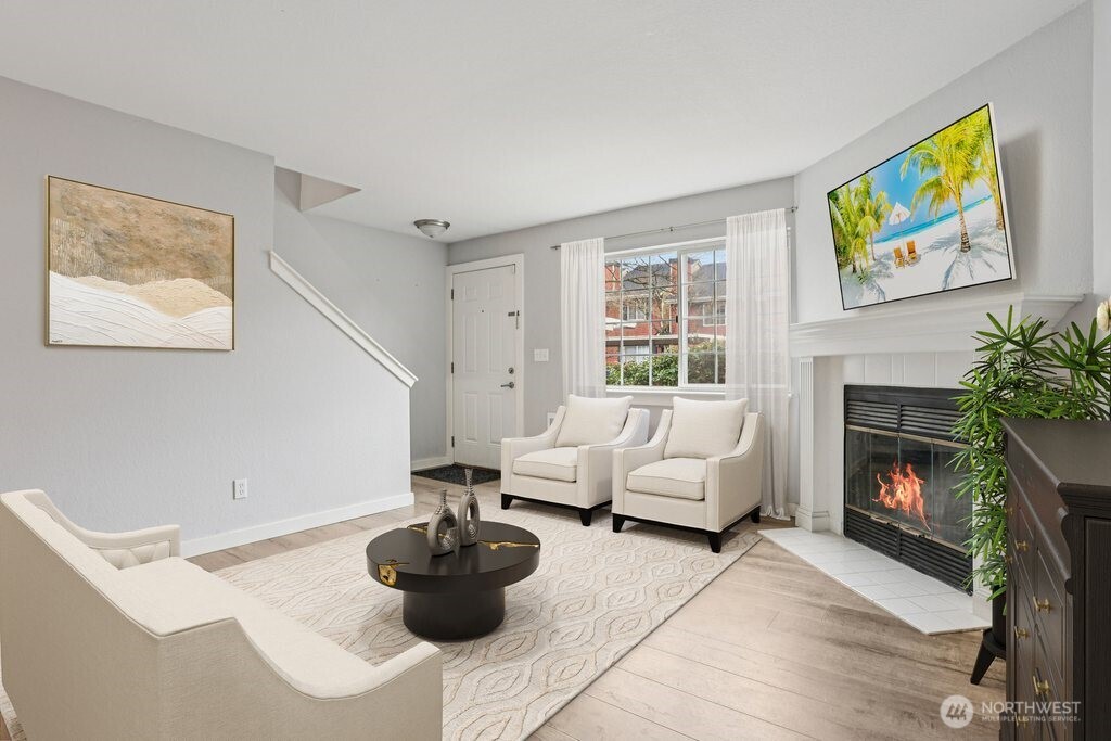 412 Center Road, Unit A1 Everett, WA 98204 - Photo 4 of 23 a living room with furniture and a fireplace