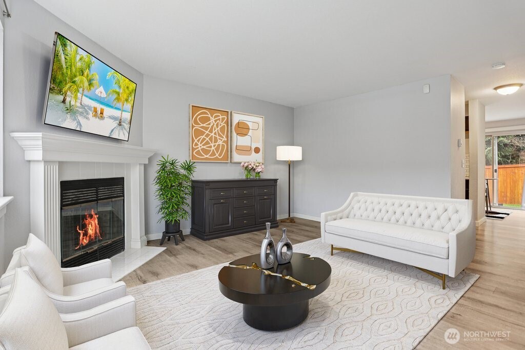 412 Center Road, Unit A1 Everett, WA 98204 - Photo 5 of 23 a living room with furniture and a fireplace