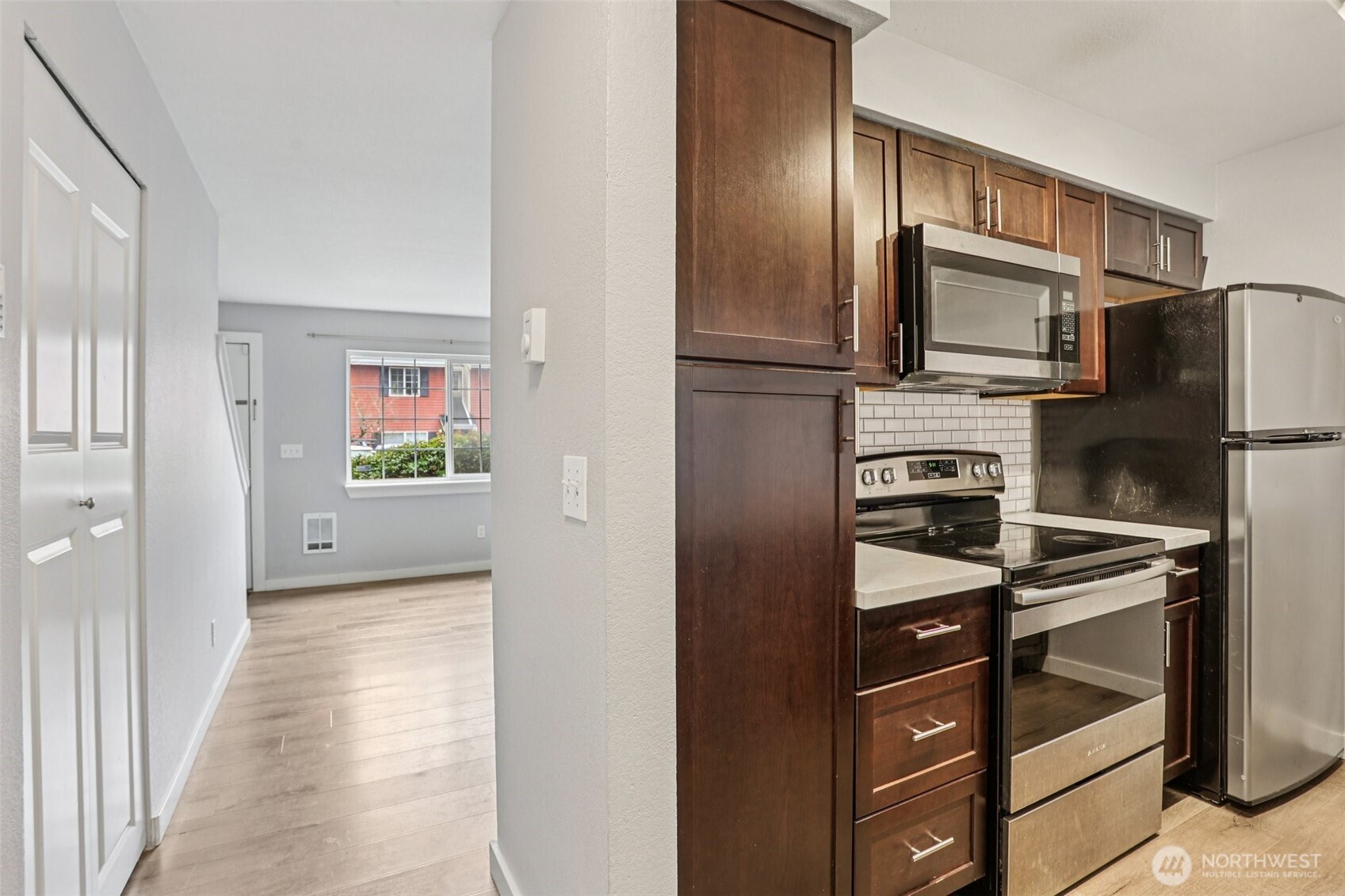 412 Center Road, Unit A1 Everett, WA 98204 - Photo 7 of 23 a view of a kitchen from the hallway
