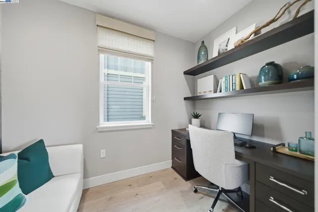 a workspace with furniture and window