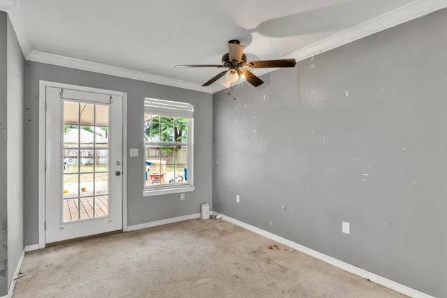 a view of an empty room with a window