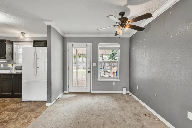 a view of kitchen with sink microwave and refrigerator