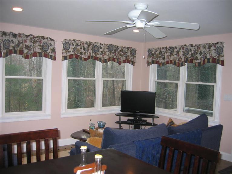 100 Ensign Road Centerville, MA 02632 - Photo 6 of 14 a view of a workspace with furniture and a flat screen tv