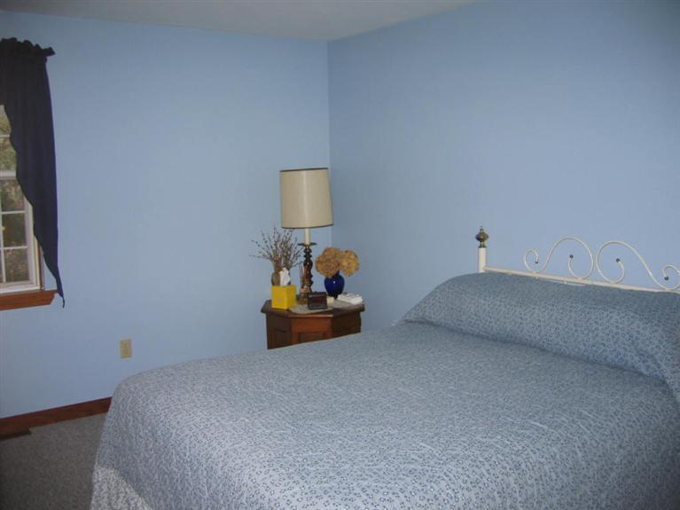 100 Ensign Road Centerville, MA 02632 - Photo 10 of 14 a bedroom with a bed and a lamp on table
