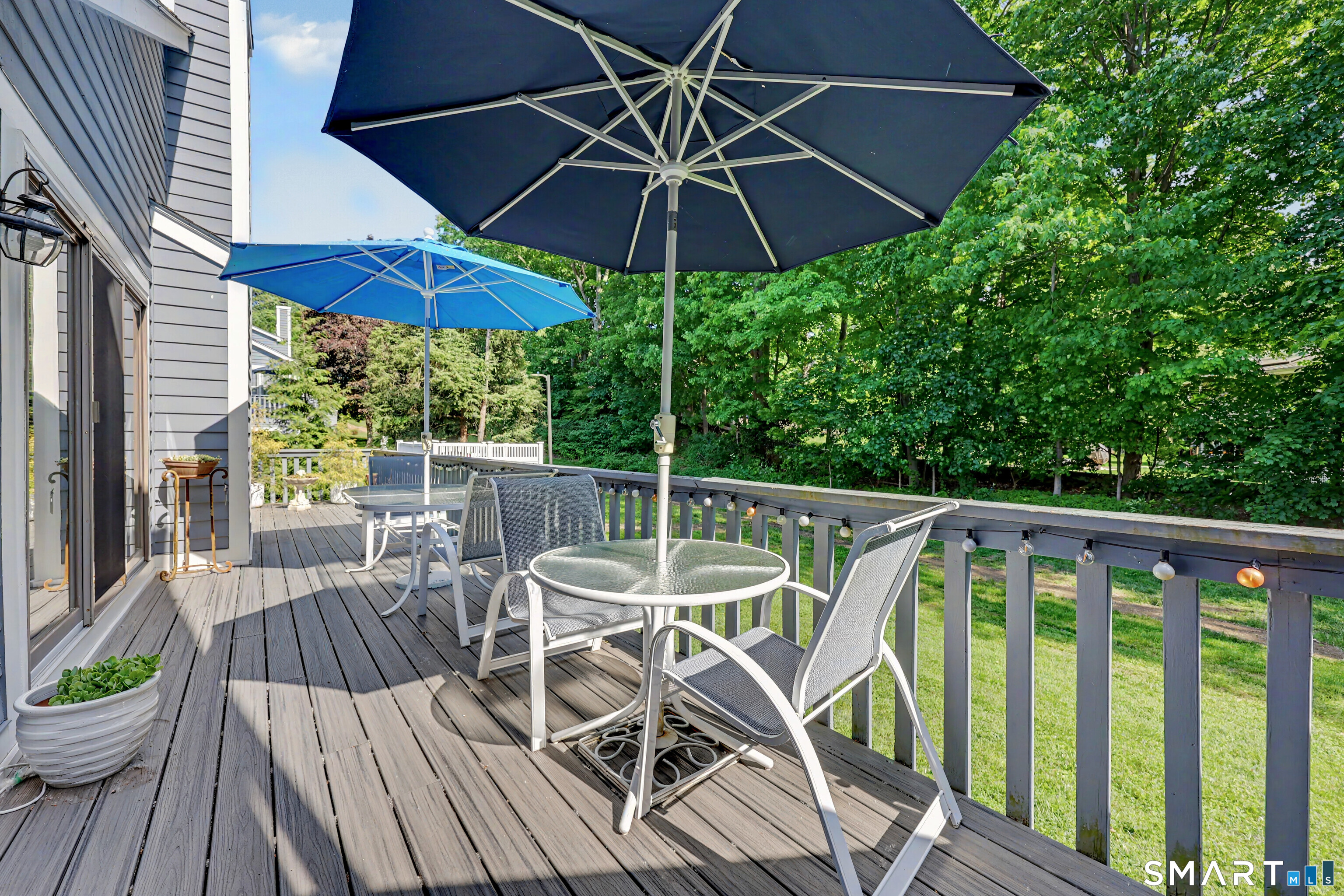 70 Fawn Ridge Lane, Unit 70 Norwalk, CT 06851 - Photo 21 of 36 a view of a chair and table on the deck