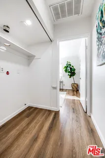 a view of an entryway with wooden floor