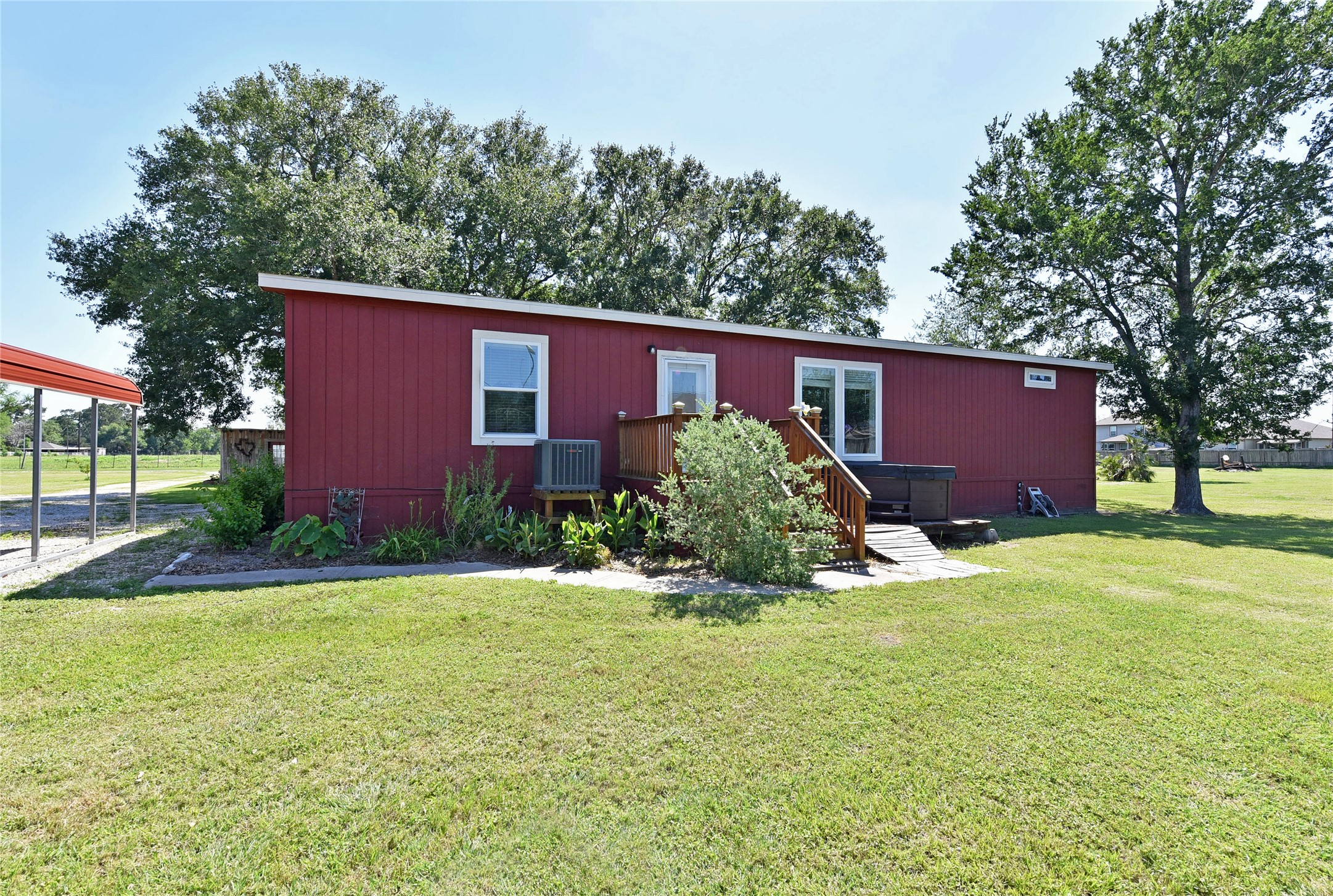 3221 Pecha Lane Rosenberg, TX 77471 - Photo 23 of 46 a brick house with a big yard and large trees