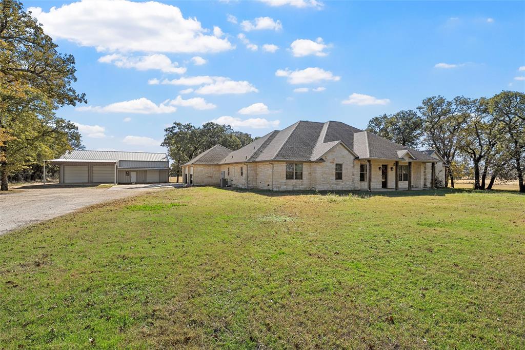 2743 Tokio Road West, TX 76691 - Photo 1 of 40 a front view of a house with a yard