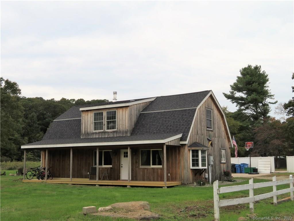 323 Shewville Road Ledyard, CT 06339 - Photo 1 of 1 a view of a house with a yard