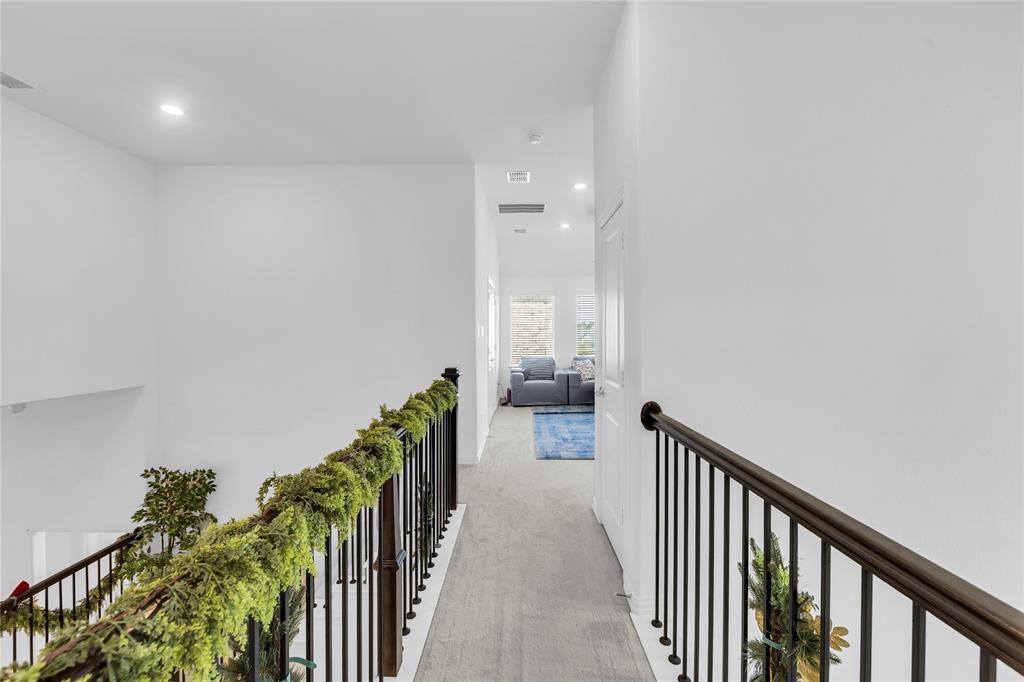 2218 Christopher Lane Euless, TX 76040 - Photo 17 of 28 a view of a hallway with wooden floor