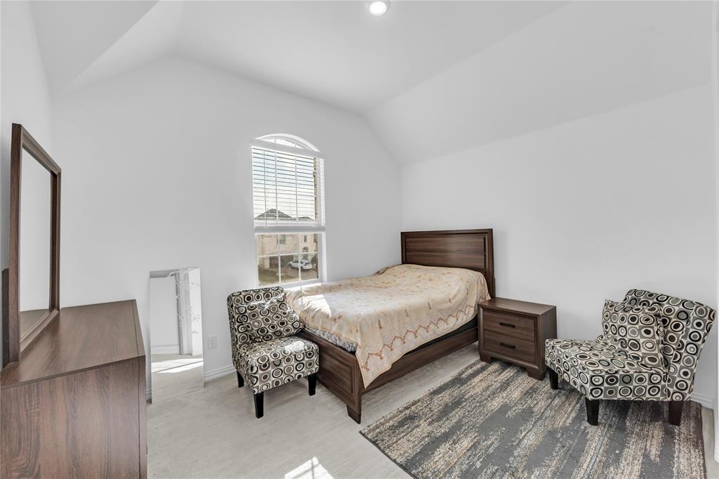 2218 Christopher Lane Euless, TX 76040 - Photo 19 of 28 a bedroom with a bed and window