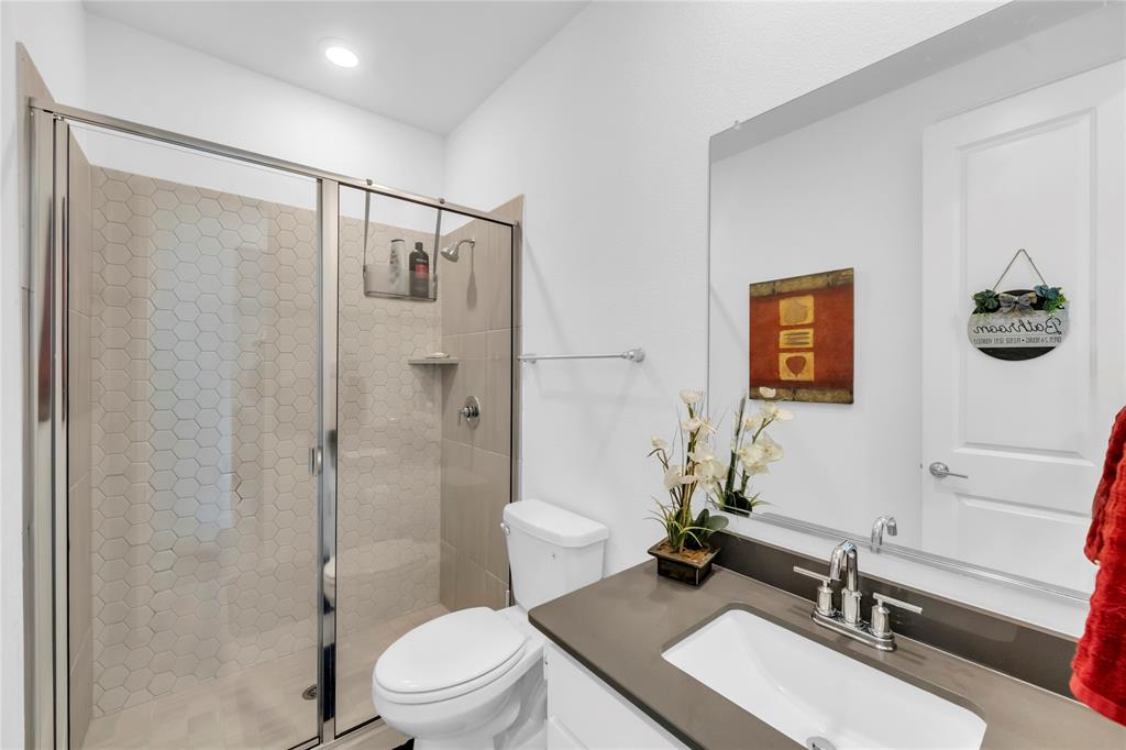 2218 Christopher Lane Euless, TX 76040 - Photo 20 of 28 a bathroom with a sink toilet and shower