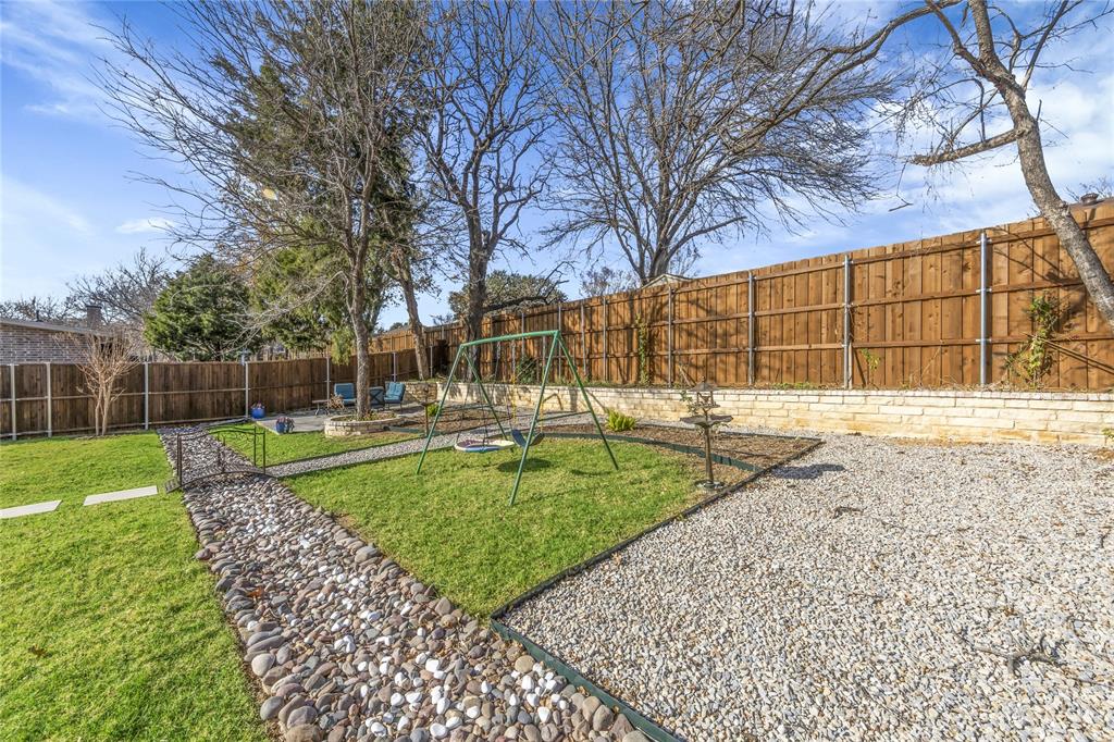 2218 Christopher Lane Euless, TX 76040 - Photo 27 of 28 a view of a backyard with a garden